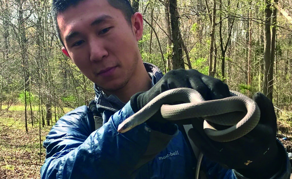 Ya-Wei (Jake) Li with snake
